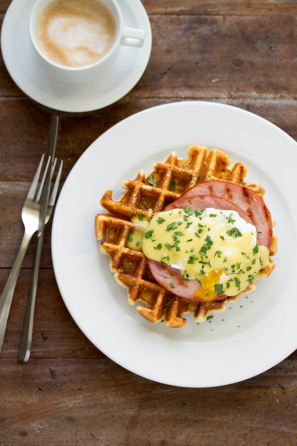 everything bagel waffle with ham poached eggs and hollandaise