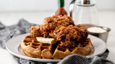 Fried chicken and waffles with hot sauce maple syrup.