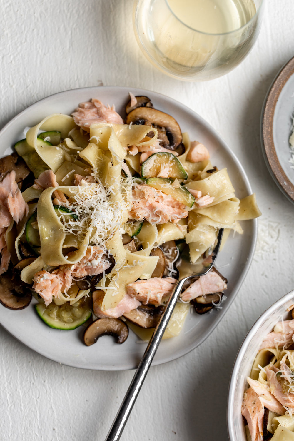 salmon and zucchini pasta recipe plate from cooking with cocktail rings