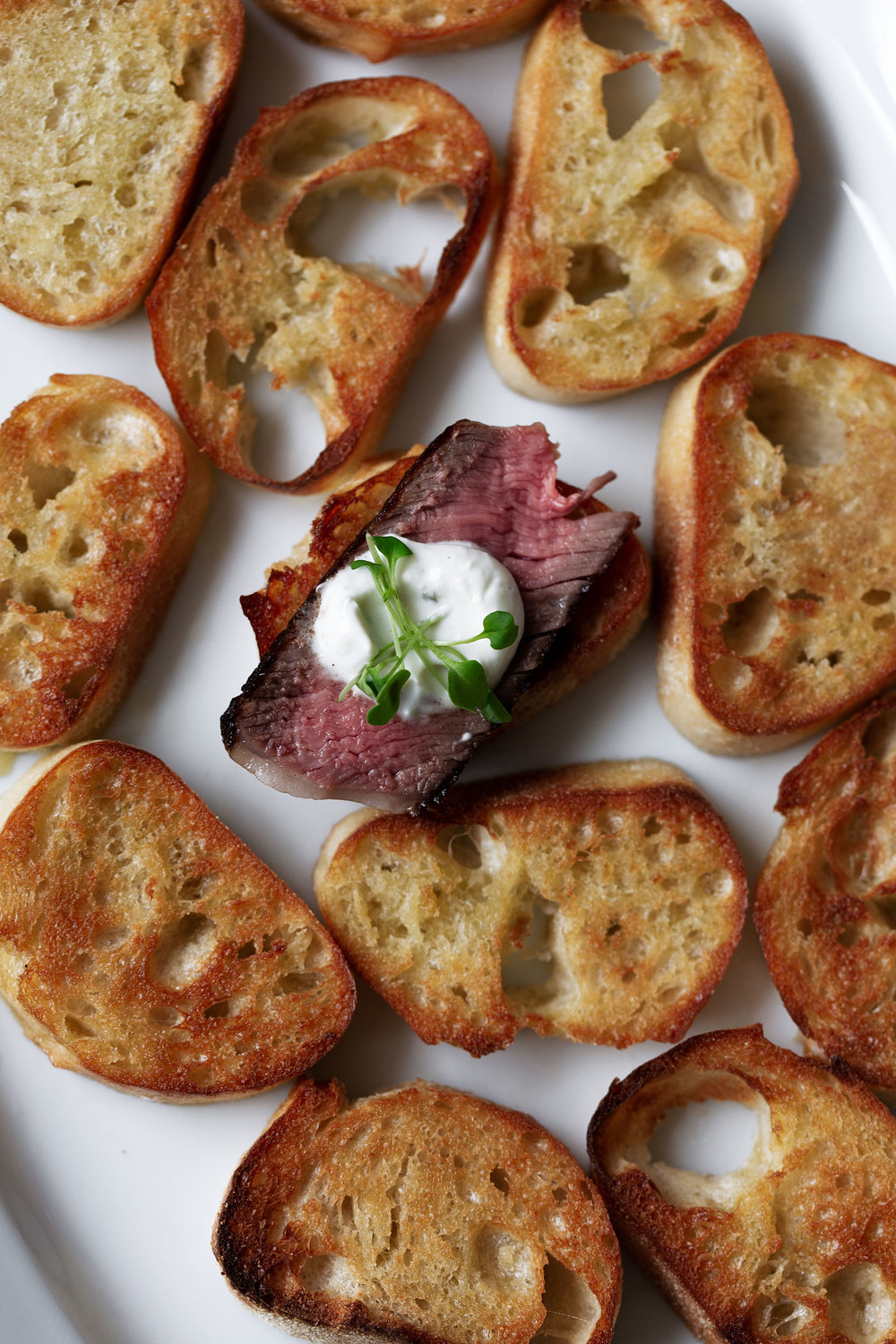 steak and boursin cheese crostini cooking with cocktail rings