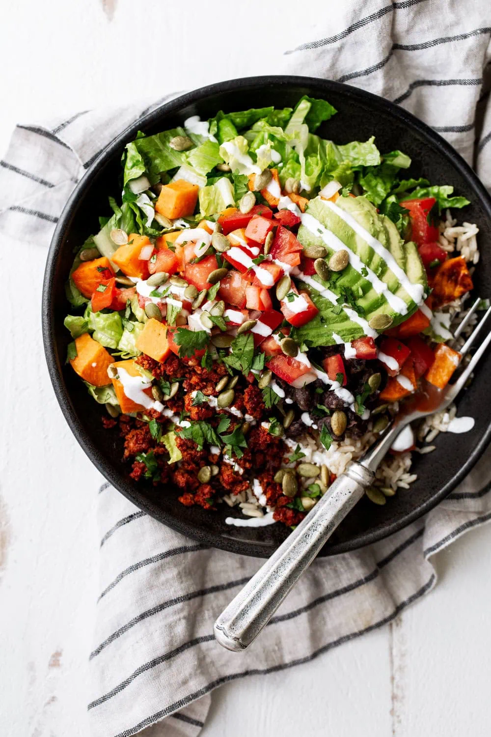 Vegan Brown Rice, Black Bean & Sweet Potato Bowl with soyrizo and avocado over romaine 