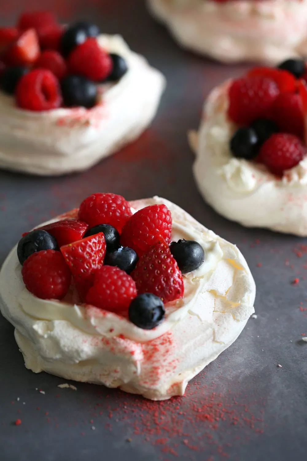 mini pavlovas with mixed berries