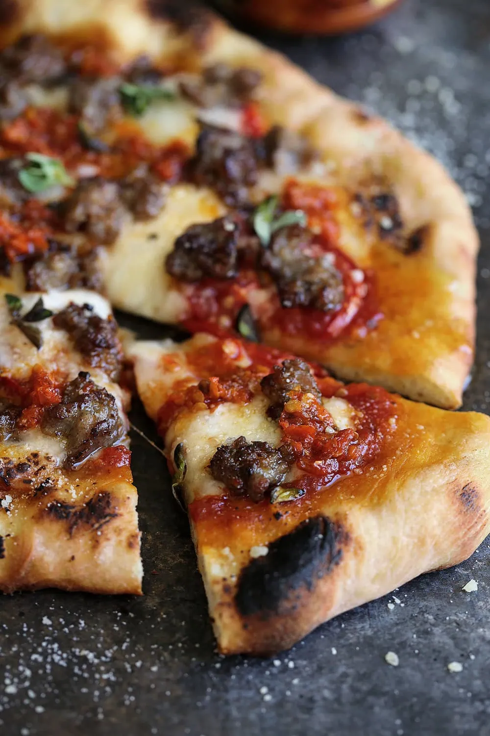 Spicy Sausage Pizza with Calabrian Chilies & Honey slice