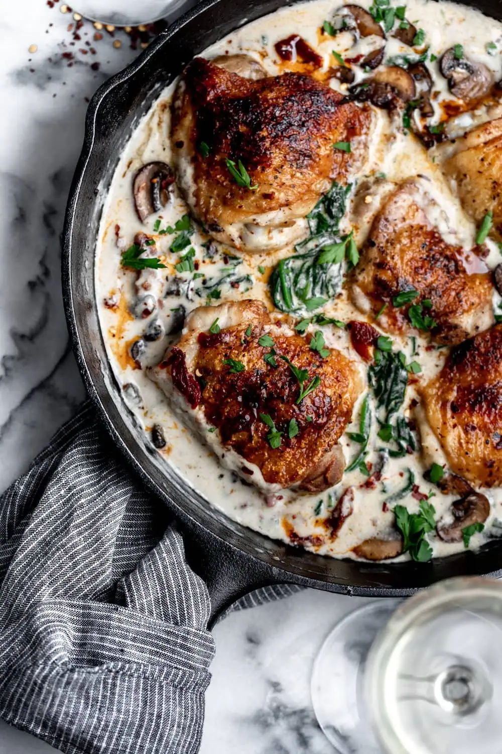 Chicken Florentine with crispy chicken thighs spinach cream sauce sun dried tomatoes and mushrooms