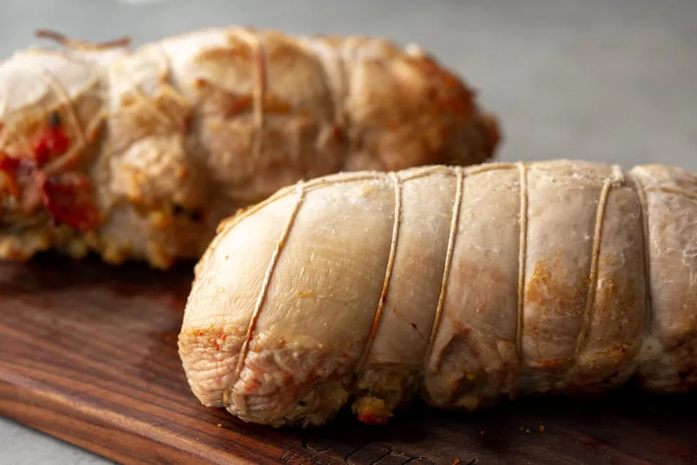 Turkey Roulades with stuffing tied up cooking with cocktail rings