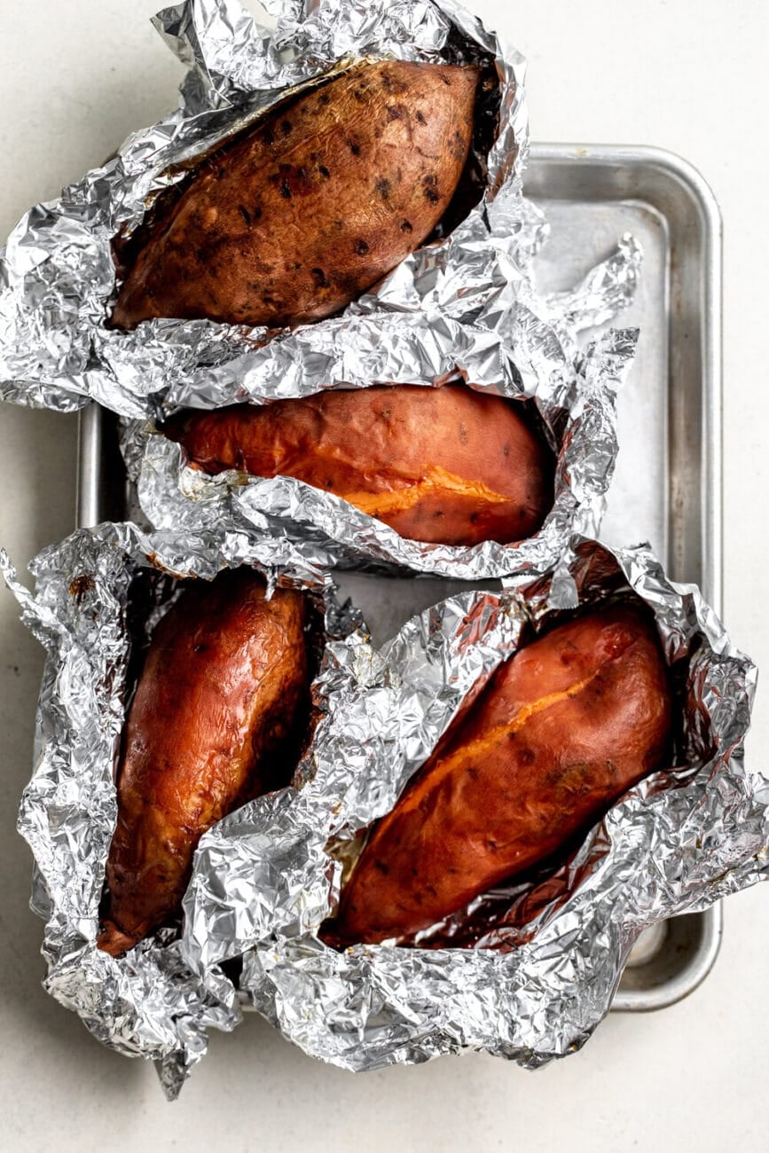roasted sweet potatoes in aluminum foil baked.