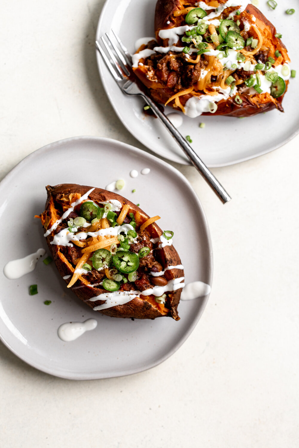 chili loaded baked sweet potatoes recipe on plate