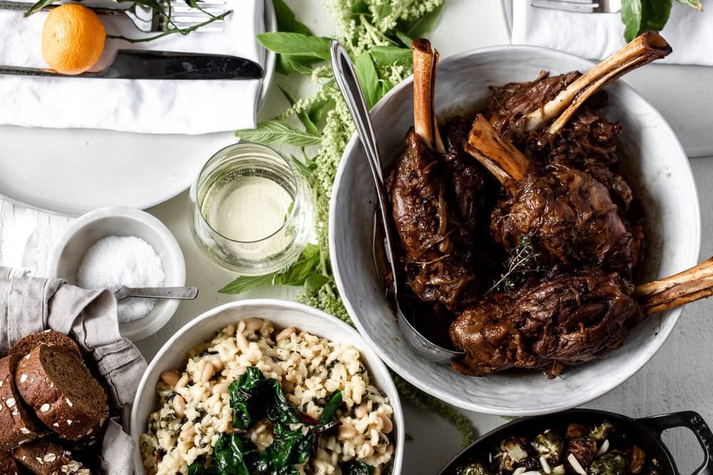 Balsamic and Caramelized Onion Braised Lamb Shanks Over White Bean