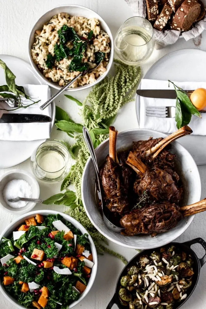 Balsamic and Caramelized Onion Braised Lamb Shanks Over White Bean & Winter Greens Risotto tablesetting.
