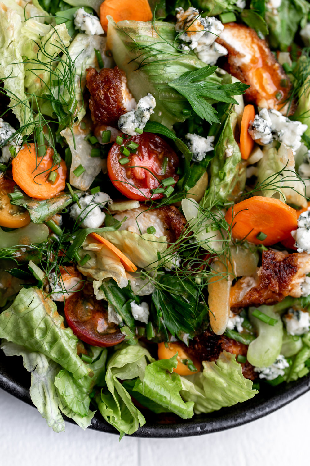 Beer-battered Fried Buffalo Chicken Salad recipe from cooking with cocktail rings closeup