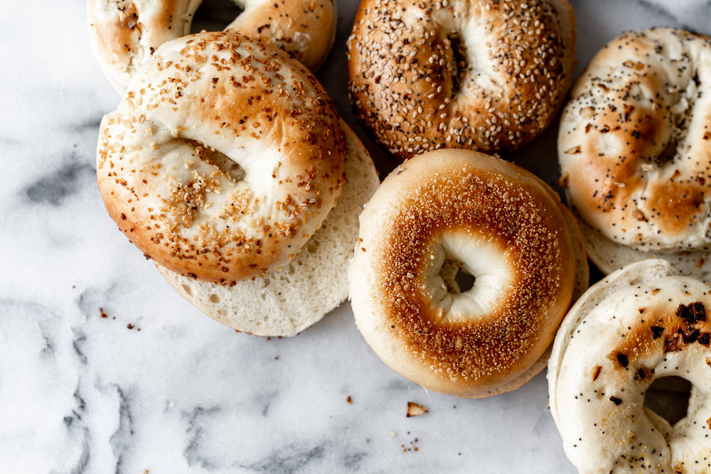 sliced bagels on marble background