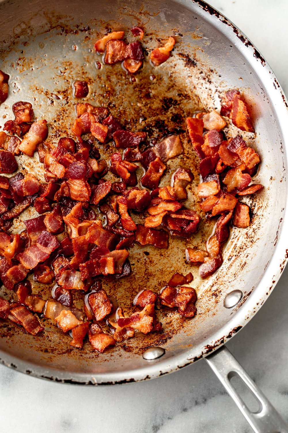 sautéed diced bacon in pan