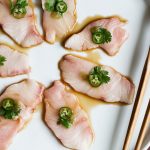 Yellowtail sashimi with serrano and ponzu.