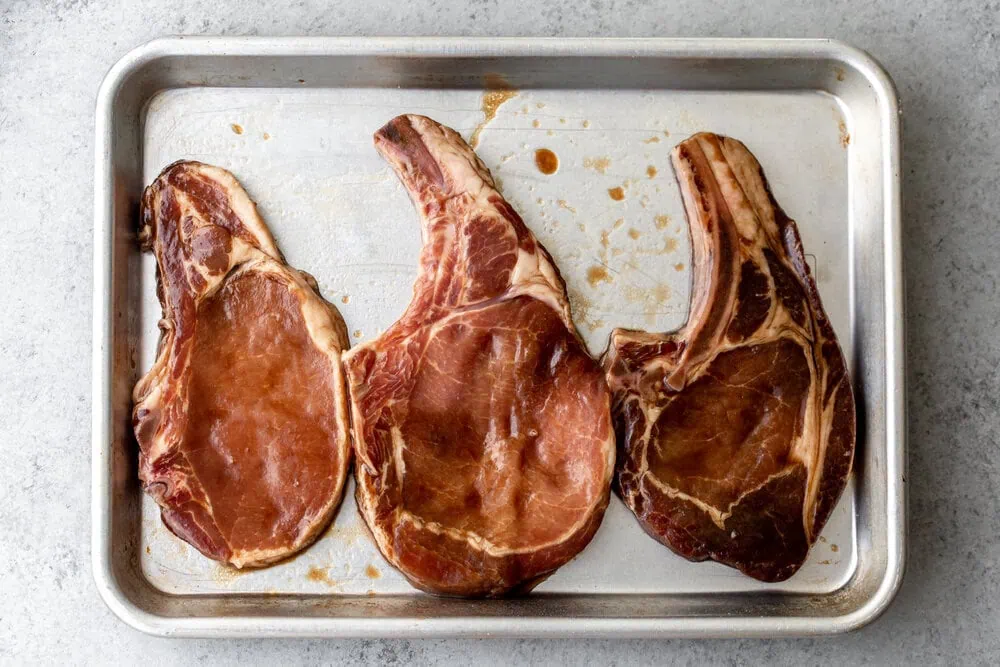 Honey Soy Pork Chops cooking with cocktail rings