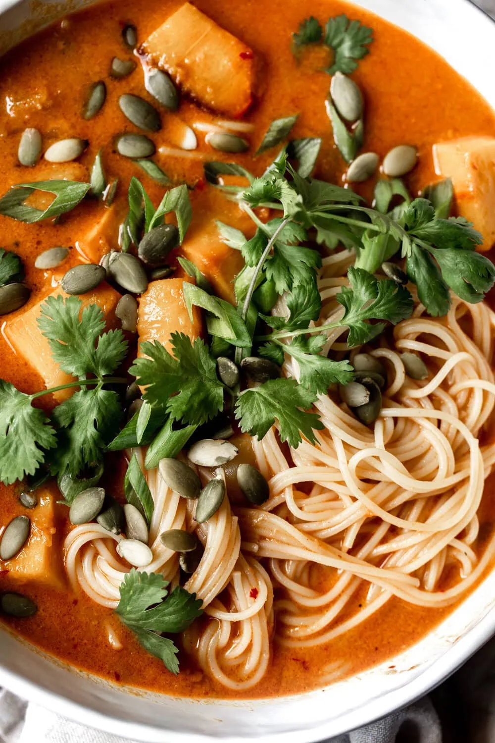 Thai Yellow Coconut Curry with Pumpkin recipe from cooking with cocktail rings closeup