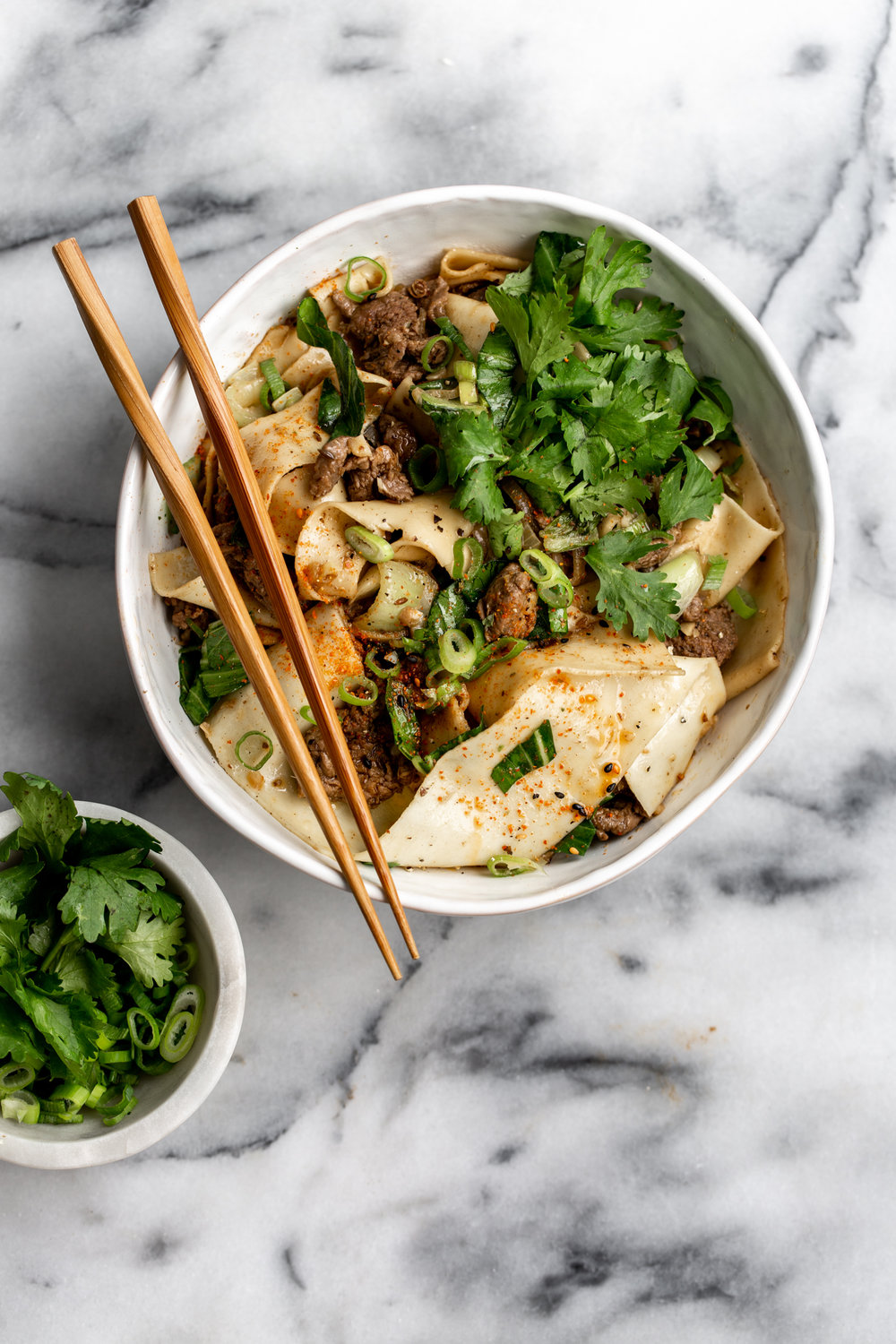 Sichuan-Style Spicy Cumin Lamb Noodles recipe in serving bowl with chopsticks 