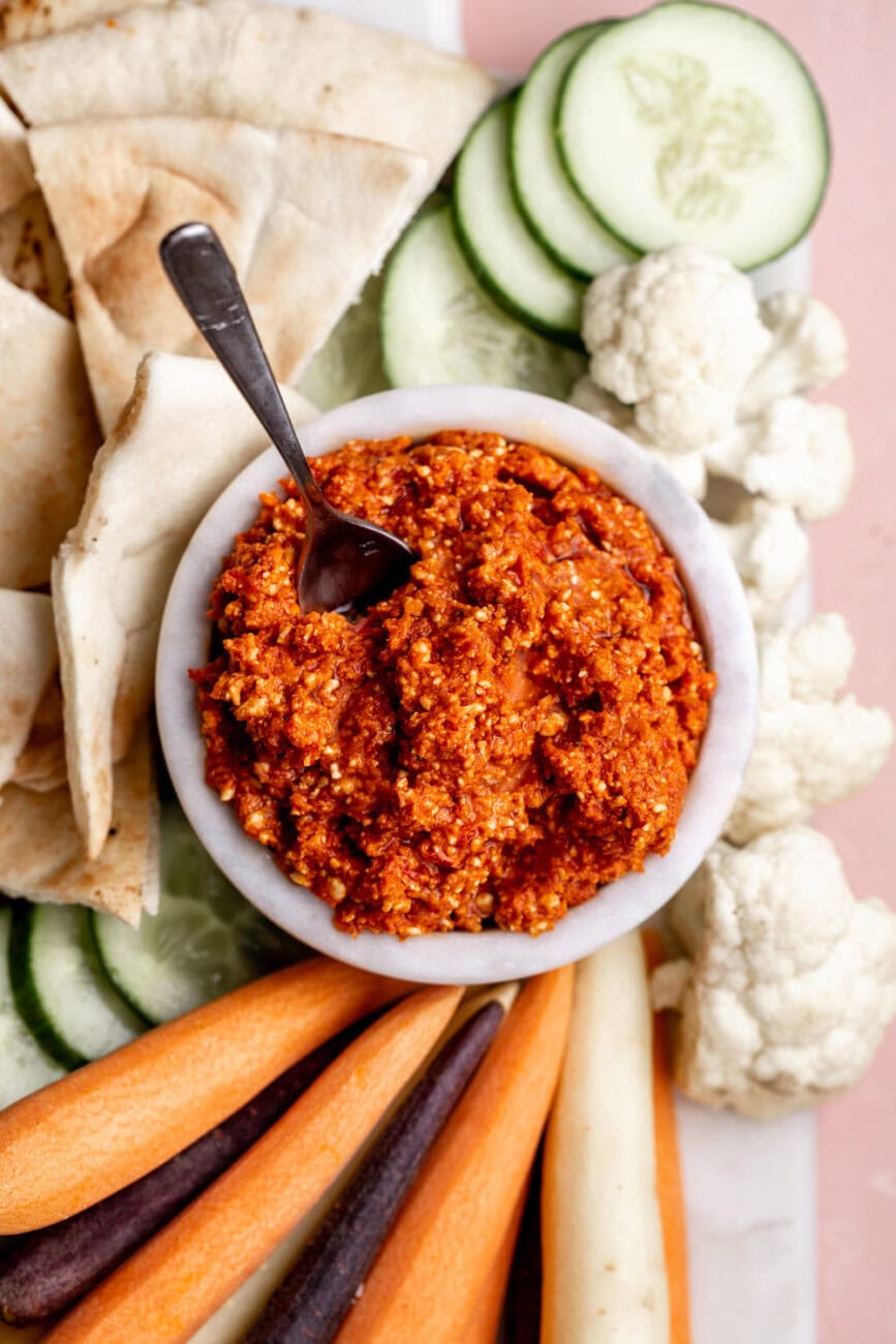 Spicy Feta Dip recipe with carrots cauliflower cucumber and pita.