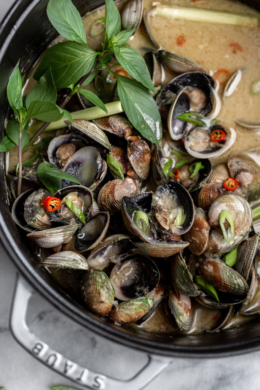 thai lemongrass coconut clams recipe from cooking with cocktail rings closeup