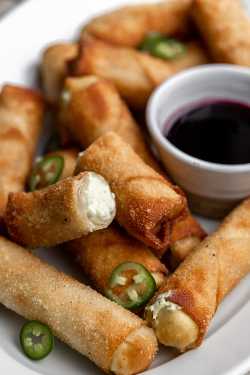 jalapeño cream cheese egg rolls fried served with huckleberry syrup.