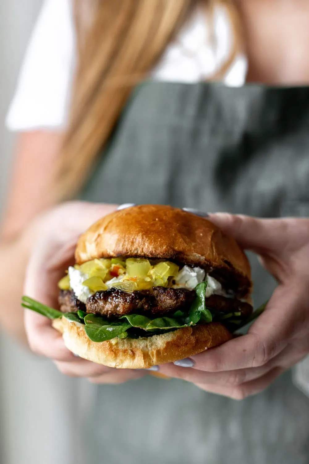 chorizo goat cheese burger with tomato chow chow recipe from cooking with cocktail rings closeup