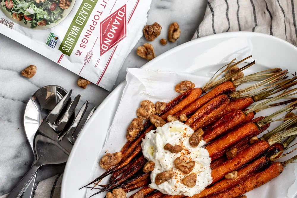 roasted carrots topped with creamy burrata cheese and crispy, glazed walnuts
