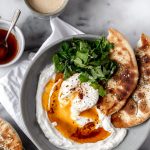 Turkish Savory Yogurt with Poached Eggs and chili butter.
