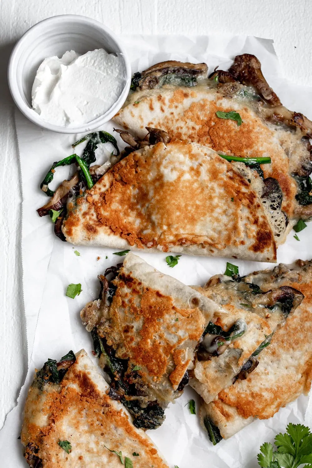 easy spinach mushroom quesadilla recipe is made with sautéed vegetable and Parmesan crust