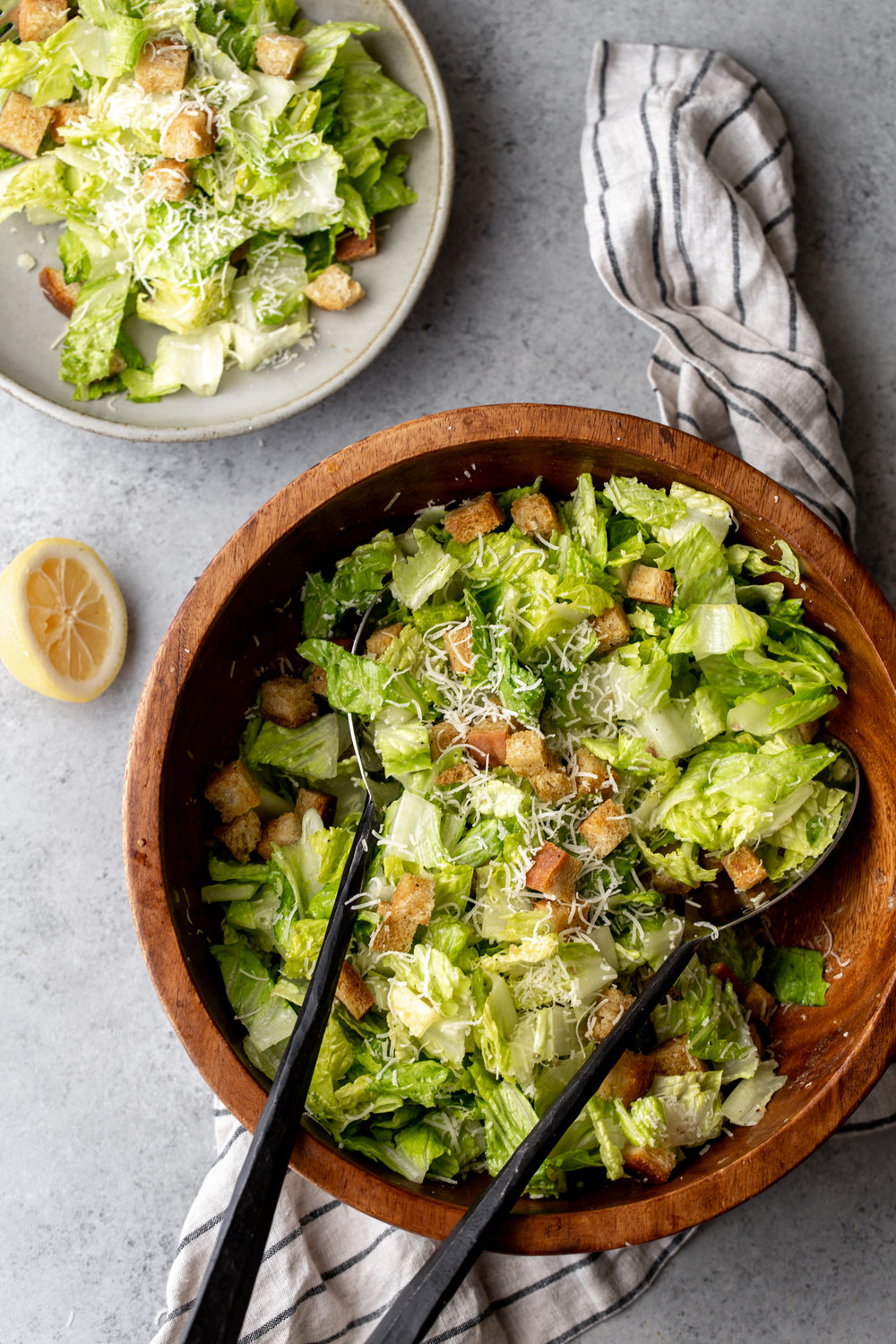 Tableside Caesar Salad with Chili Oil Croutons and freshly grated parmesan cheese