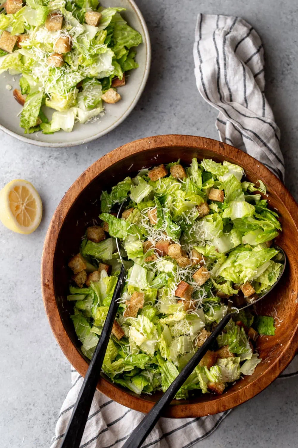 Tableside Caesar Salad with Chili Oil Croutons and freshly grated parmesan cheese