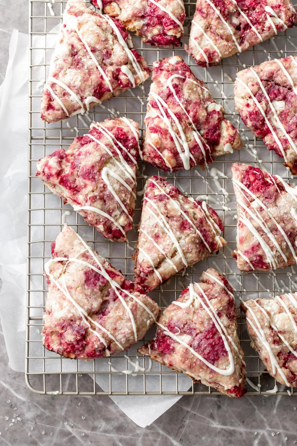 raspberry white chocolate scones recipe drizzled with white chocolate
