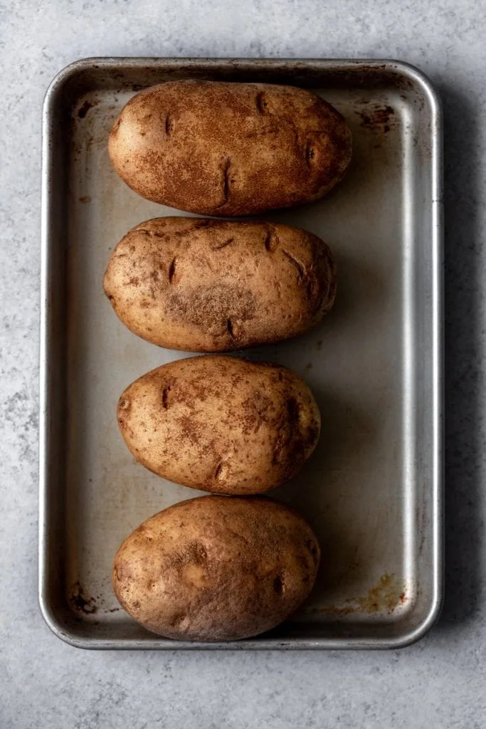 russet potatoes on baking sheet