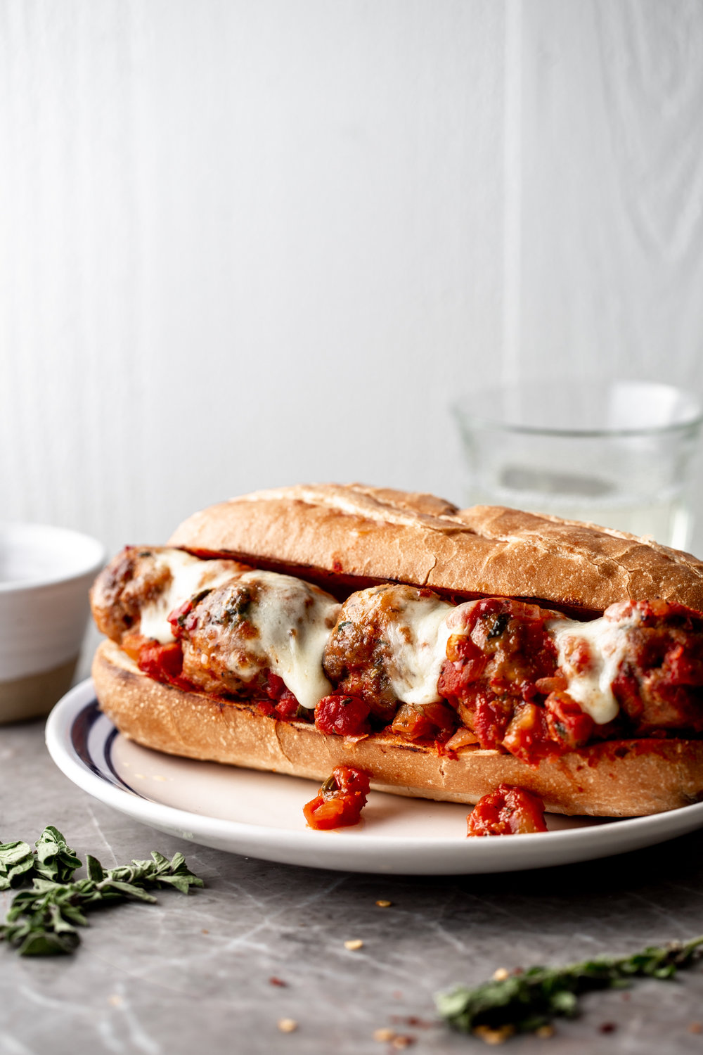 Meatball Subs with Spicy Beef and Pork Meatballs with melted mozzarella and provolone cheese