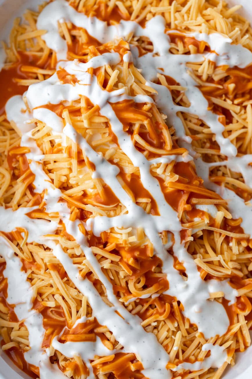 cheesy buffalo chicken dip mixture in pan.