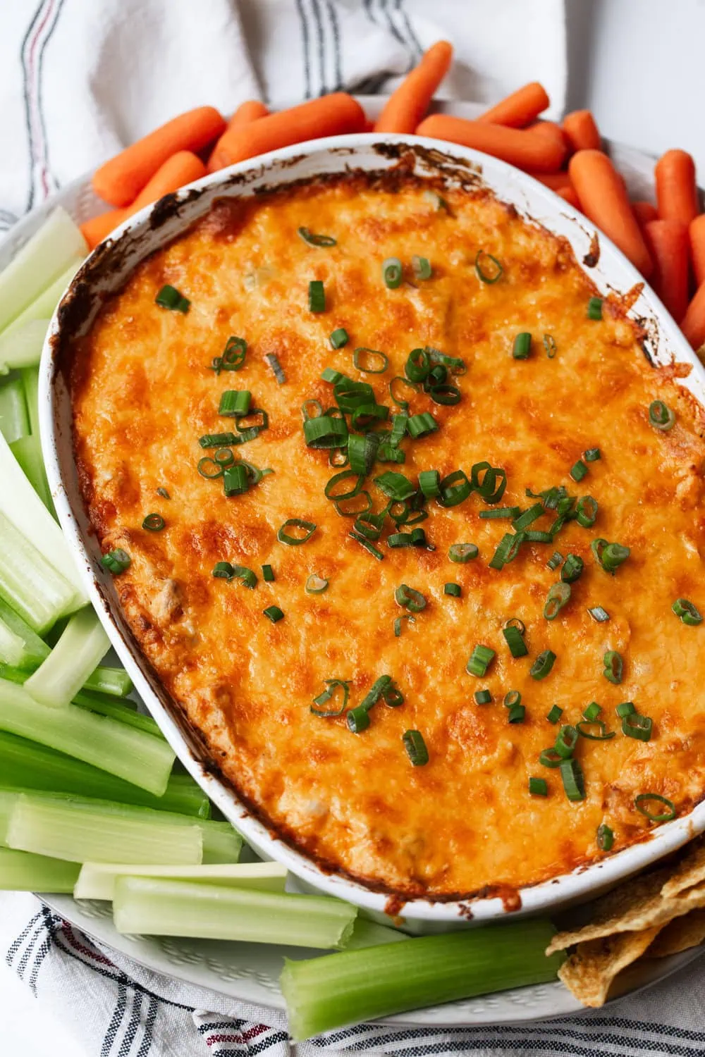 buffalo chicken dip recipe with tortilla chips, celery and carrots