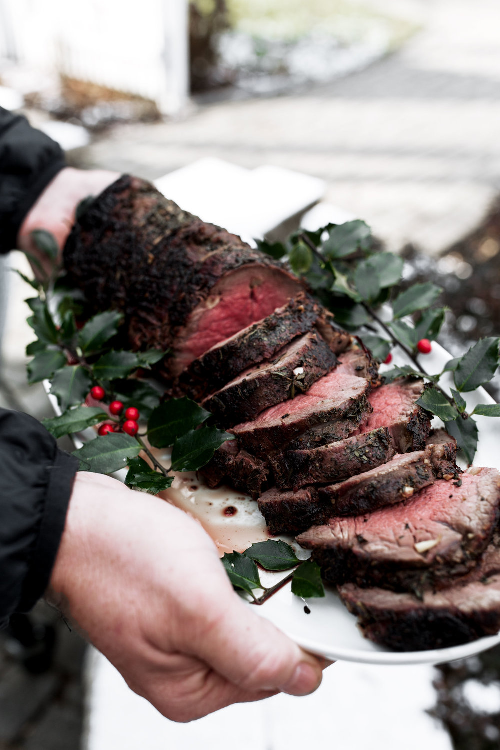 sliced holiday Herb Roast Beef Tenderloin recipe from cooking with cocktail rings