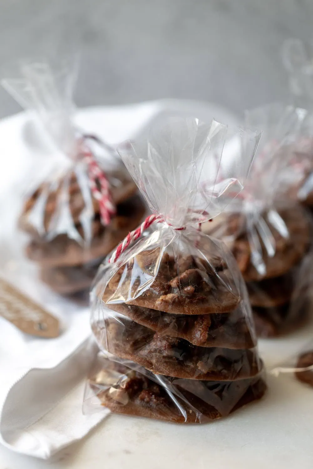 Creamy Bananas Foster Pecan Pralines recipe wrapped in cellophane holiday gift