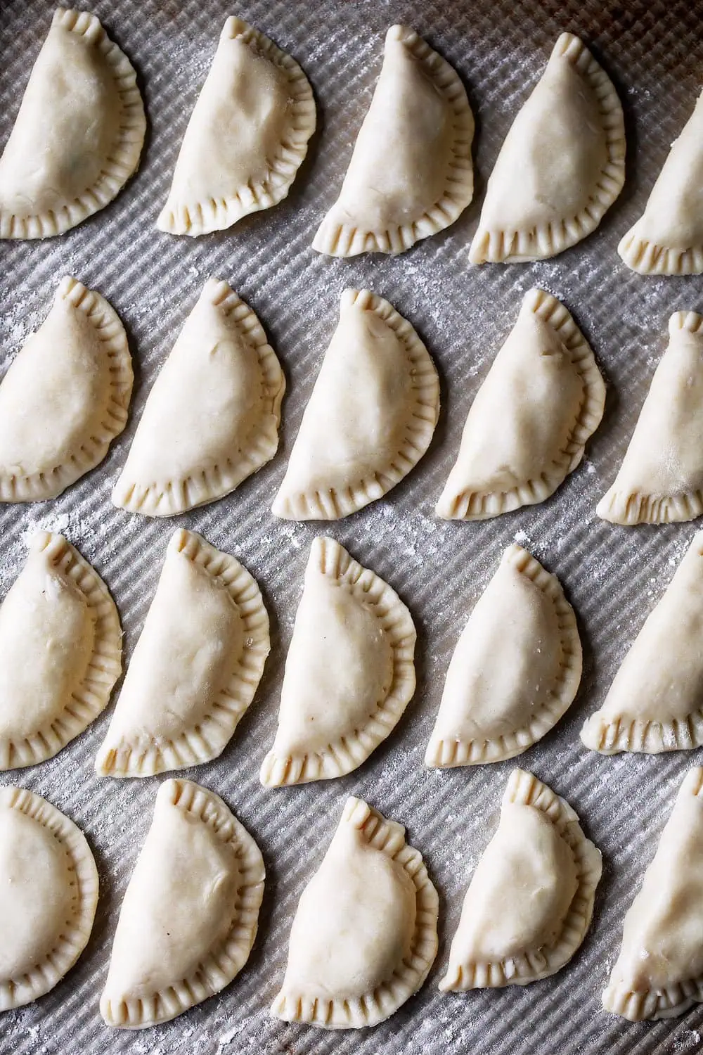 Potato and Cheese Pierogies shaped on baking sheet