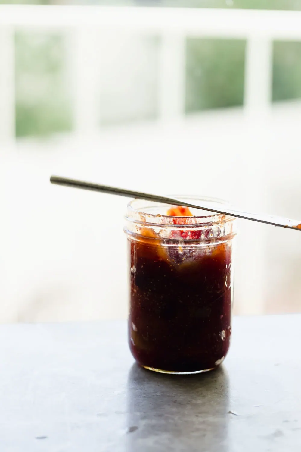 jar of fig jam cooking with cocktail rings
