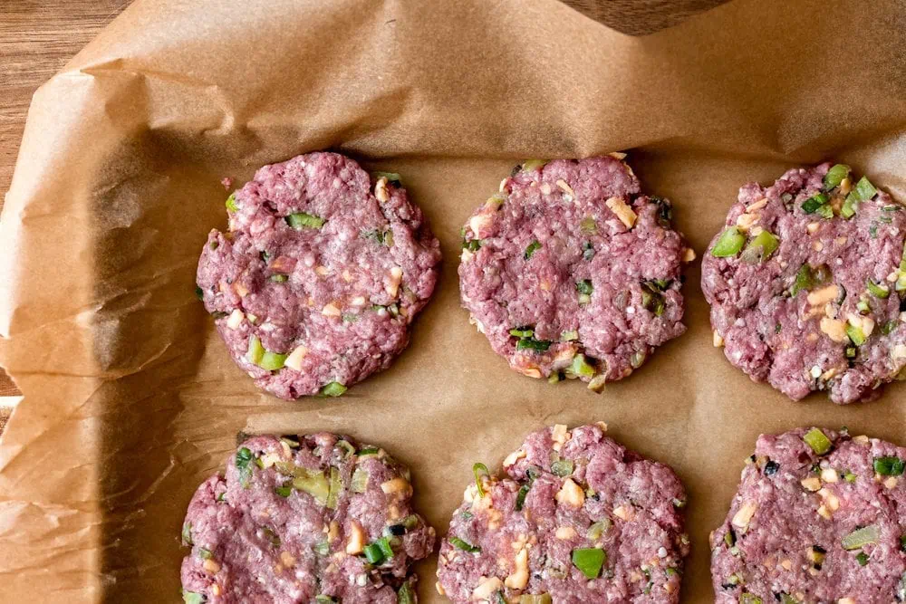 cheeseburger patties cooking with cocktail rings ingredients