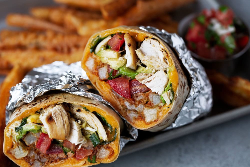 california chicken burrito with seasoned fries cooking with cocktail rings