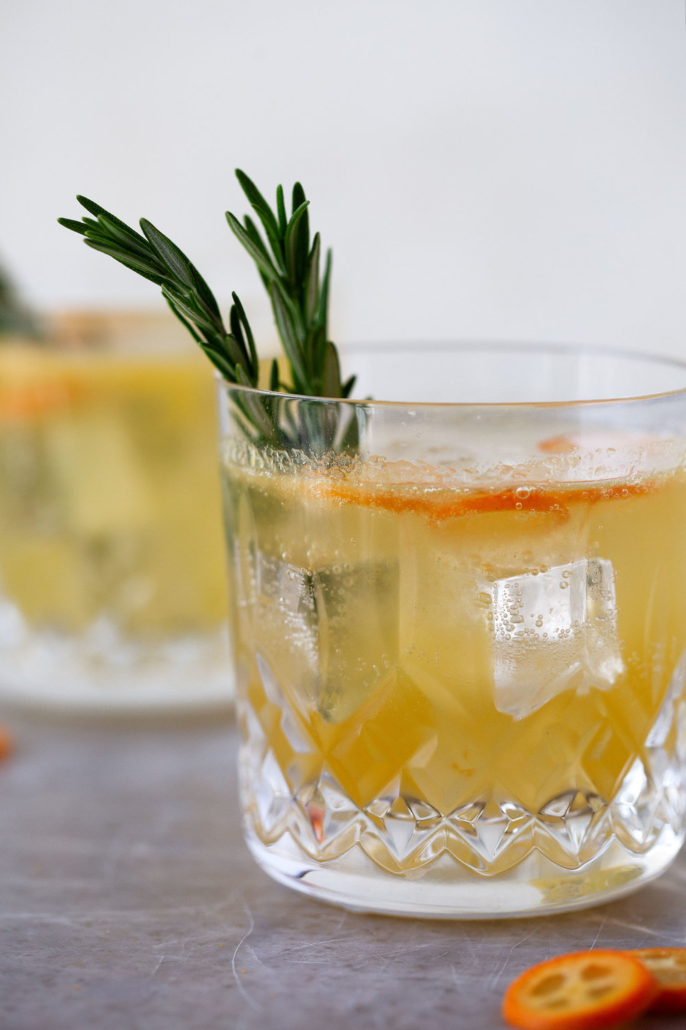 rosemary kumquat gin fizz cocktail recipe from cooking with cocktail rings closeup