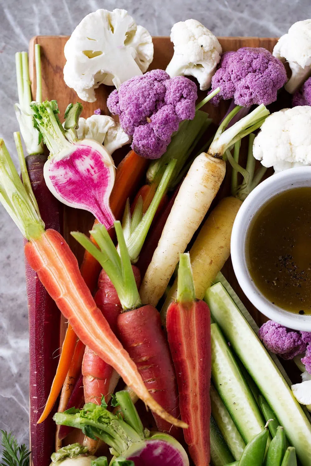 bagna cauda crudité platter with carrots radish cucumber and cauliflower