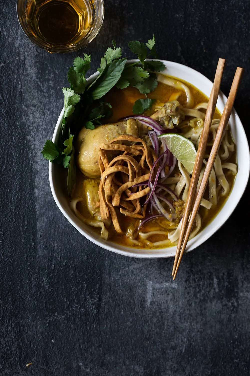 chicken khao soi cooking with cocktail rings