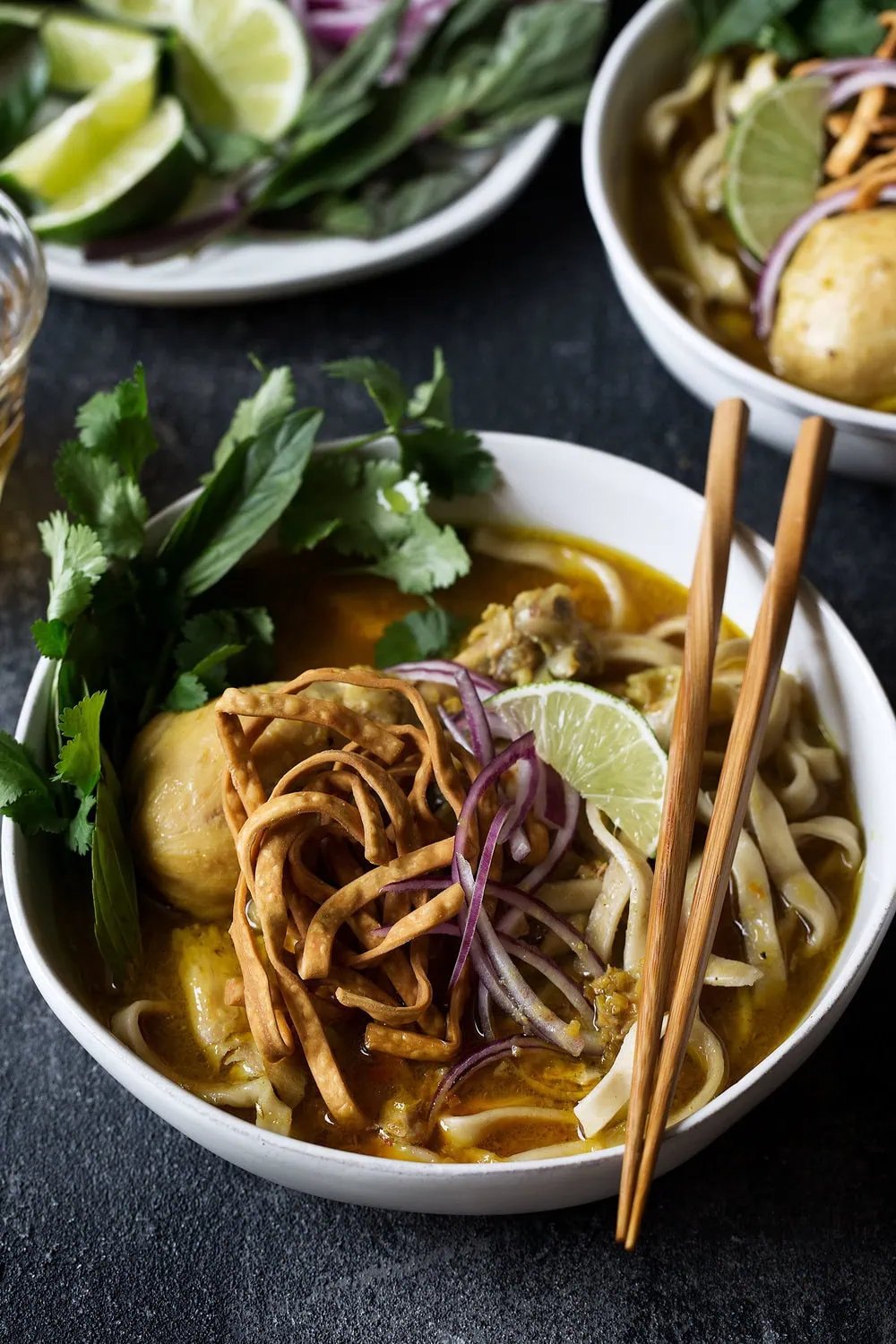 closeup bowl chicken khao soi recipe from cooking with cocktail rings