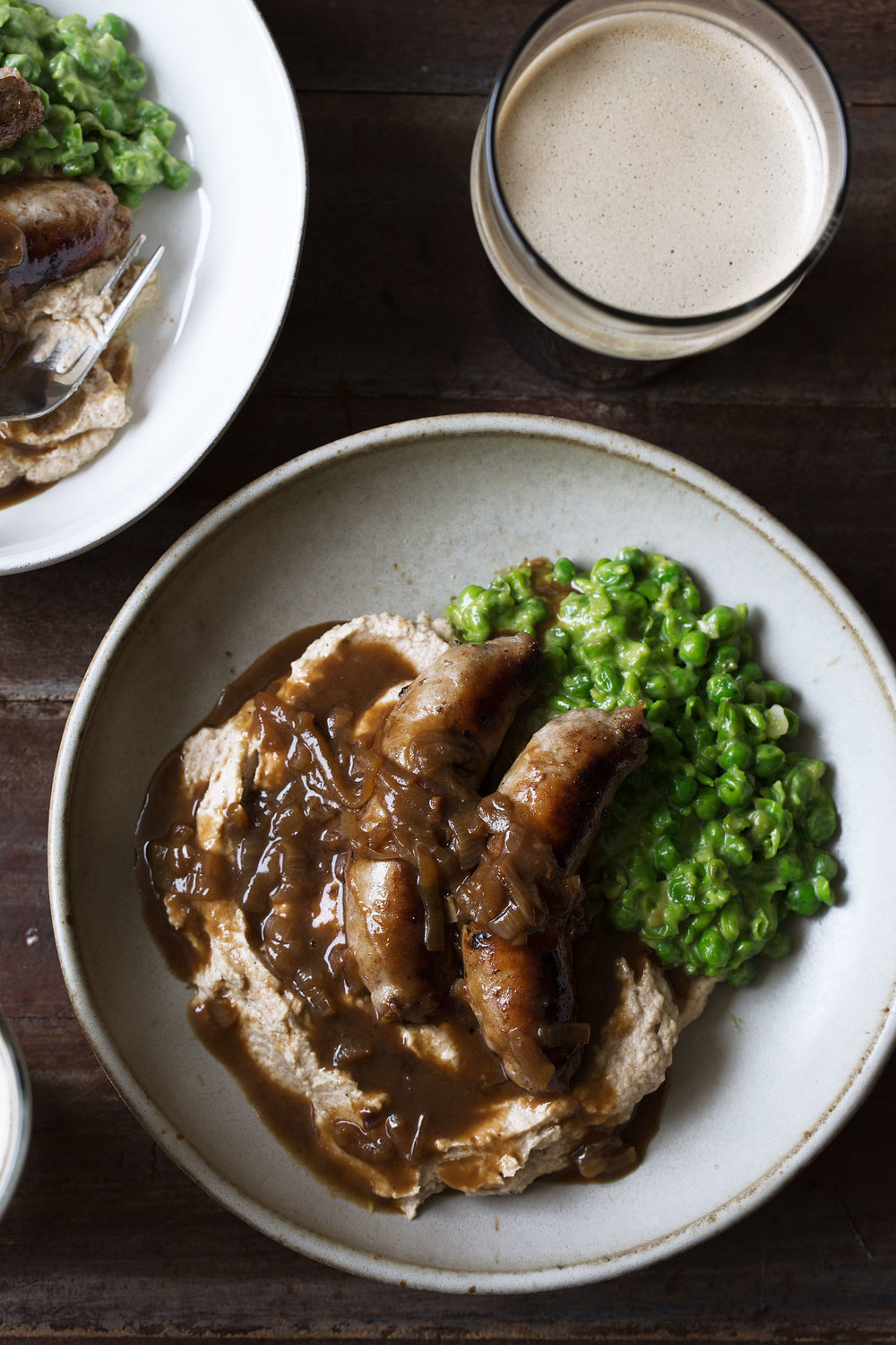 bangers and cauliflower mash with guinness onion gravy and mushy peas recipe from cooking with cocktail rings