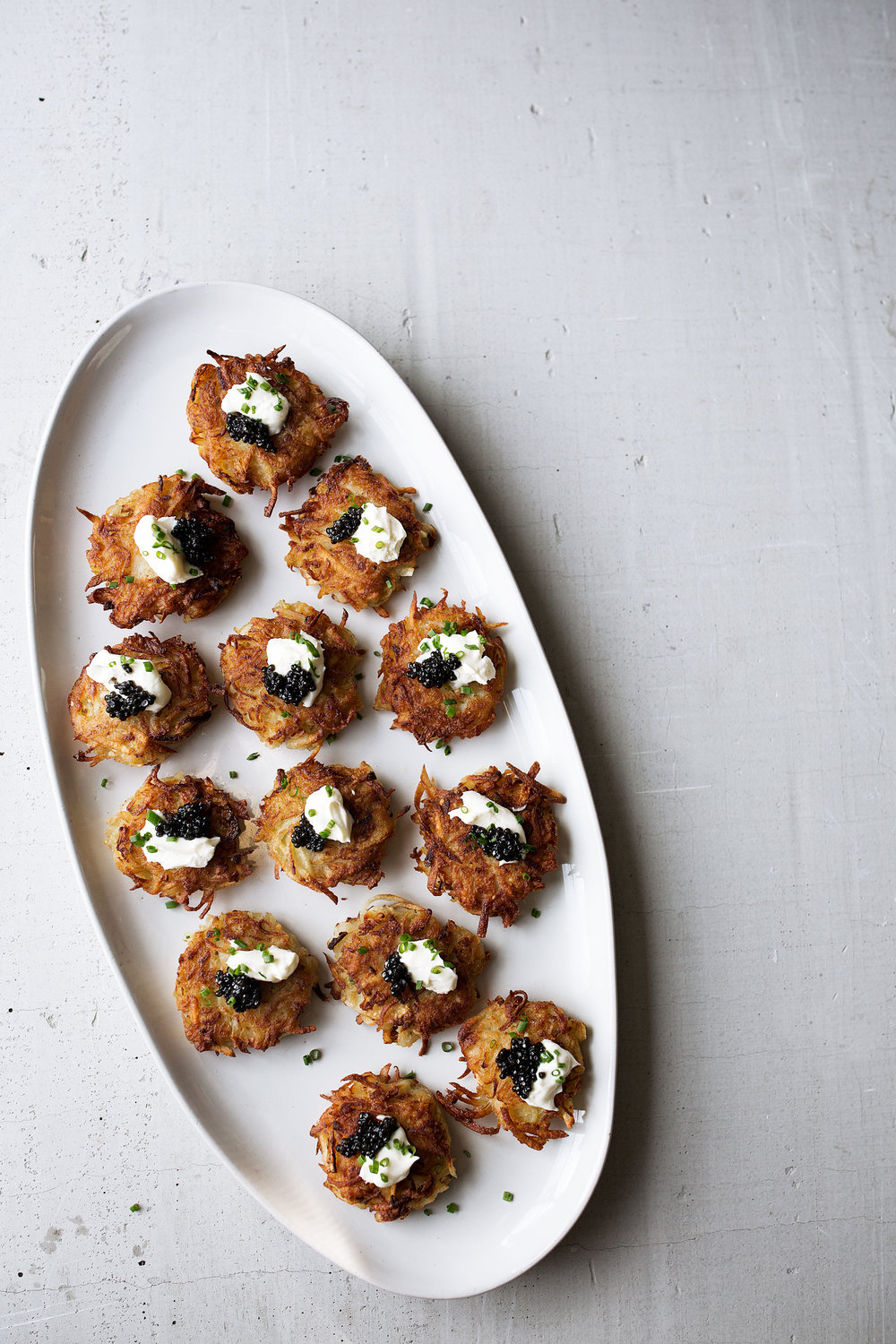 plated bougie latkes with caviar recipe from cooking with cocktail rings