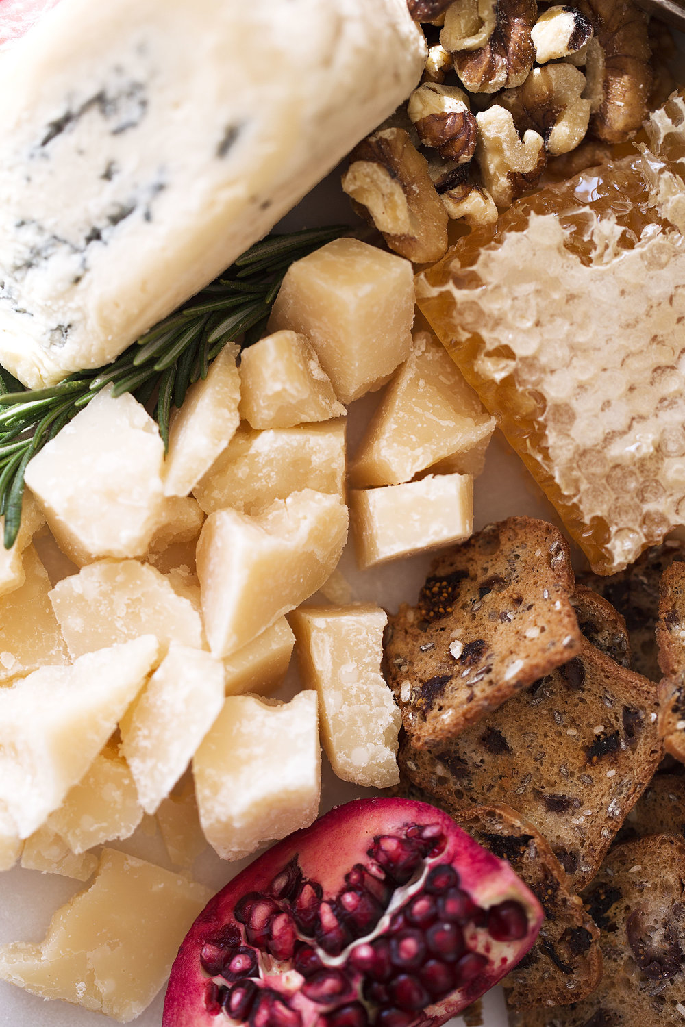 host with the most holiday cheese board closeup parmesan and honeycomb