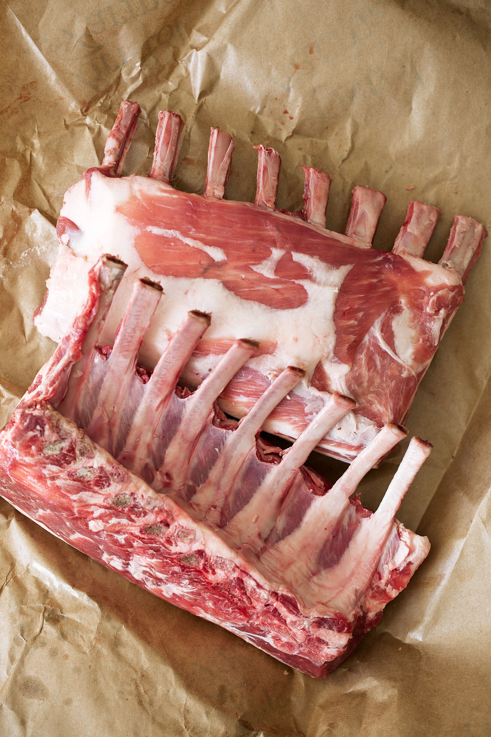 racks of american lamb cooking with cocktail rings