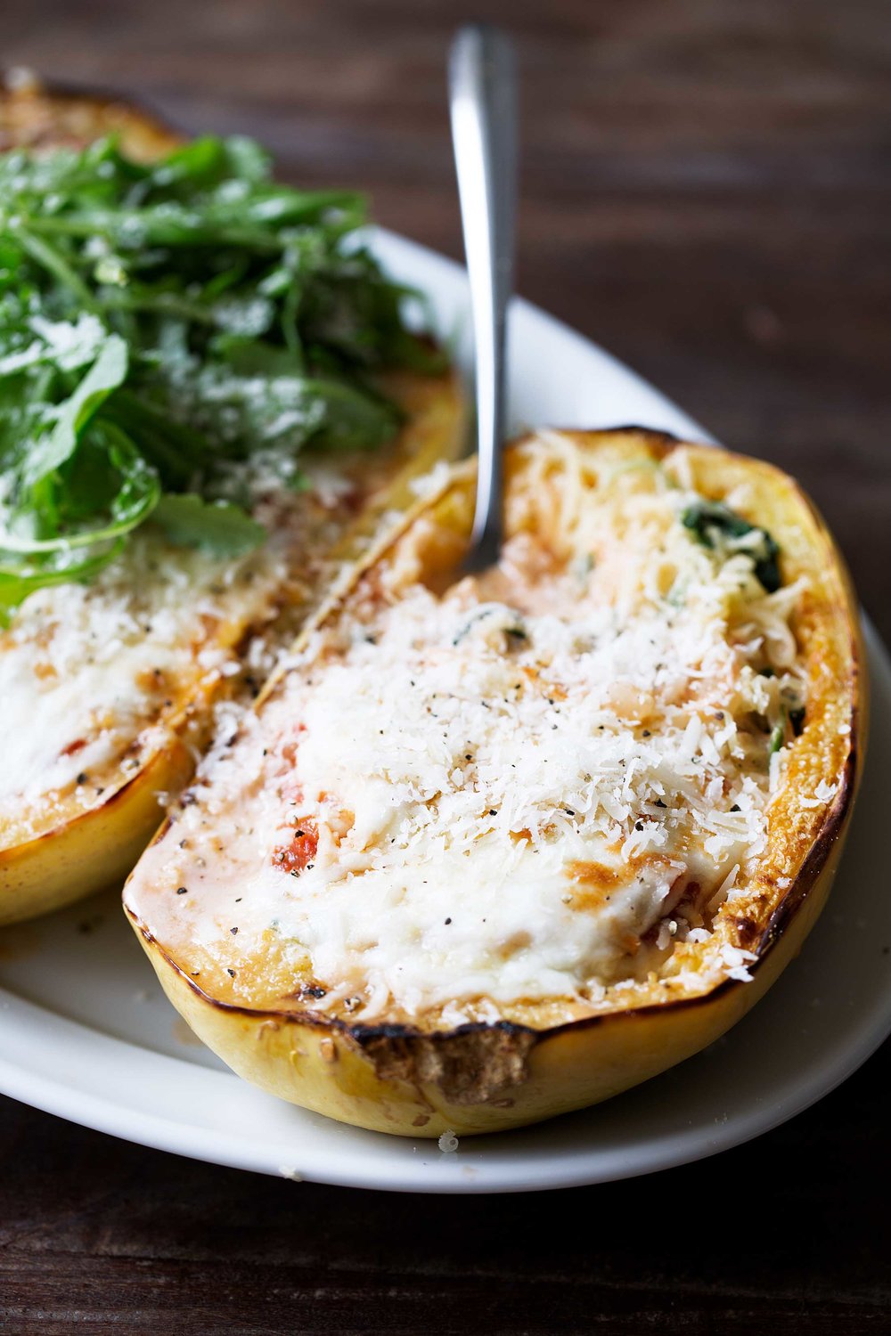 closeup spaghetti squash lasagna boats baked until melted with fork