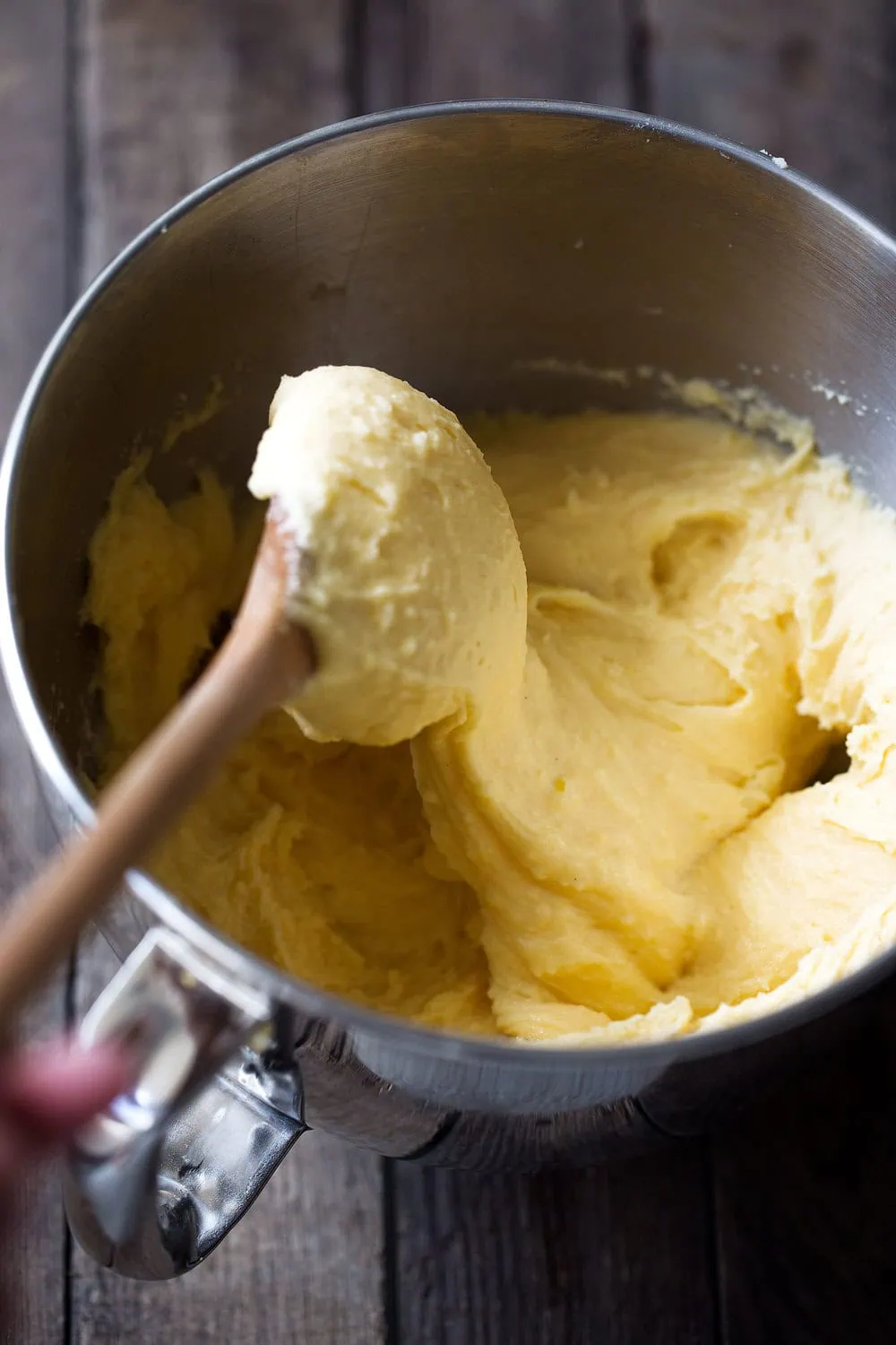 whipped cheddar potatoes with wooden spoon cooking with cocktail rings